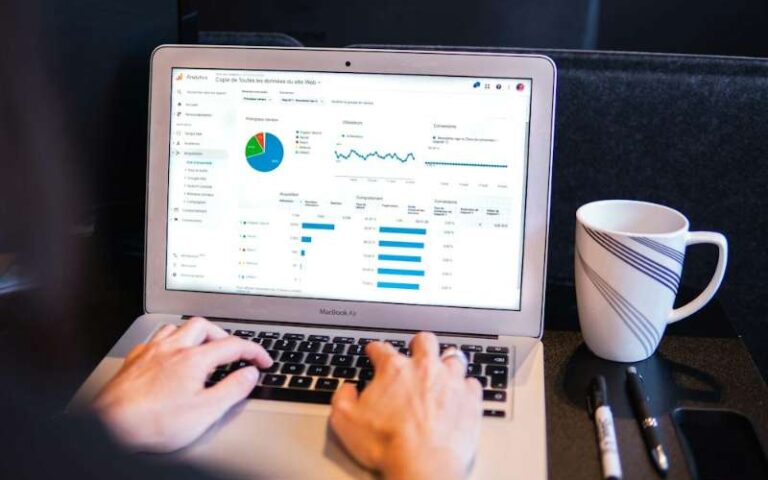 Working on SEO reports on a laptop