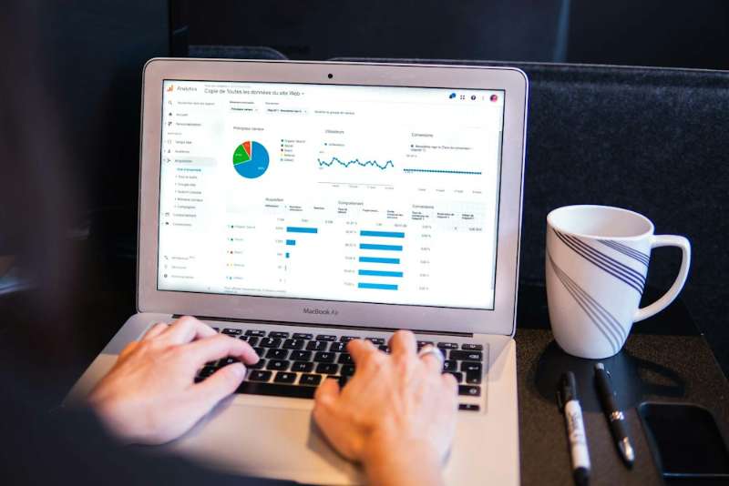Working on SEO reports on a laptop